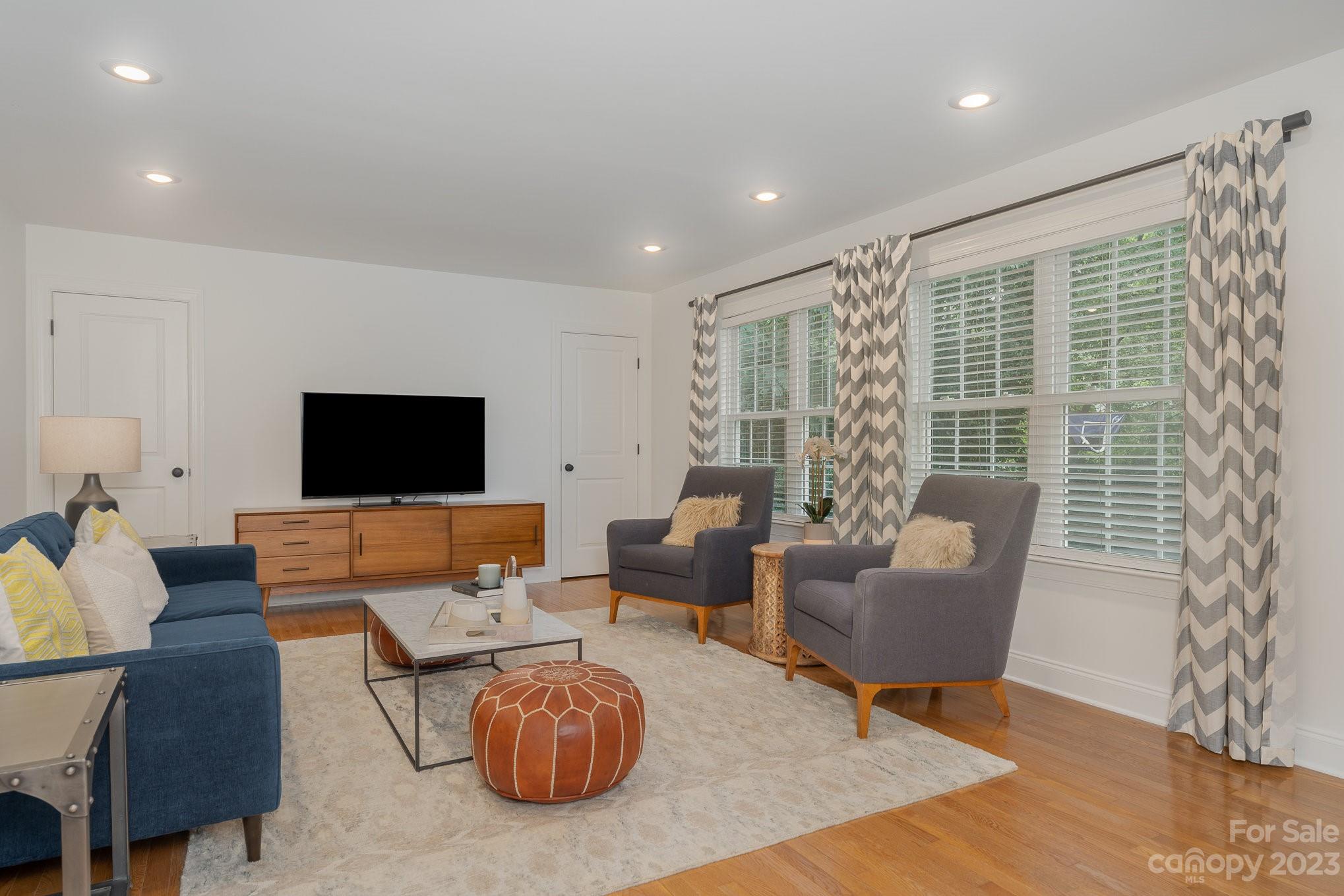 5816 Sharon Road Charlotte, NC 28210 - Photo 14 of 33 a living room with furniture and a flat screen tv