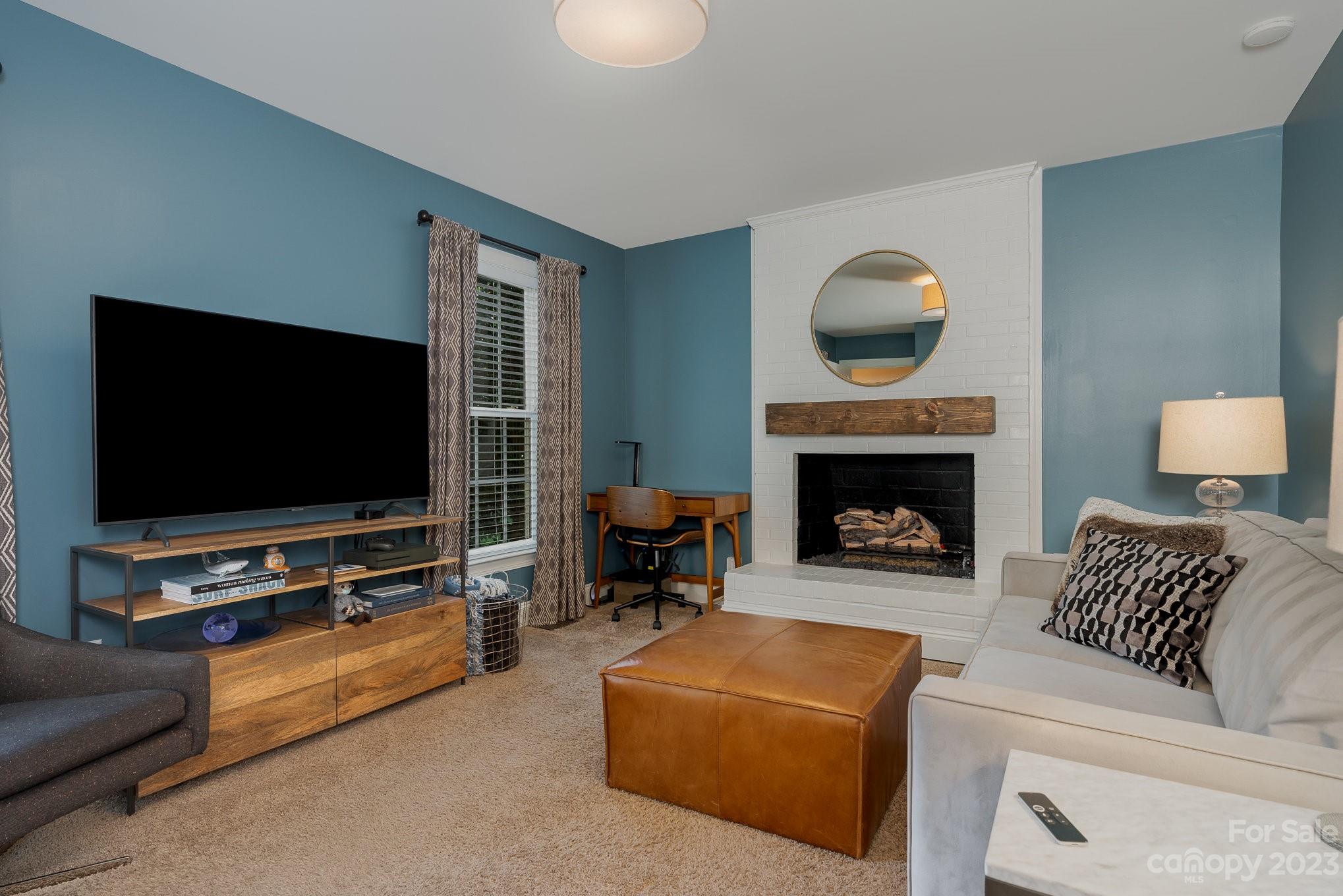 5816 Sharon Road Charlotte, NC 28210 - Photo 20 of 33 a living room with furniture and a flat screen tv