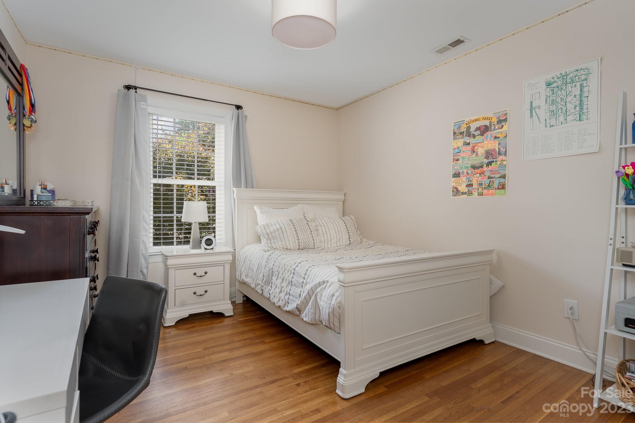 5816 Sharon Road Charlotte, NC 28210 - Photo 22 of 33 a bed room with a bed and a window