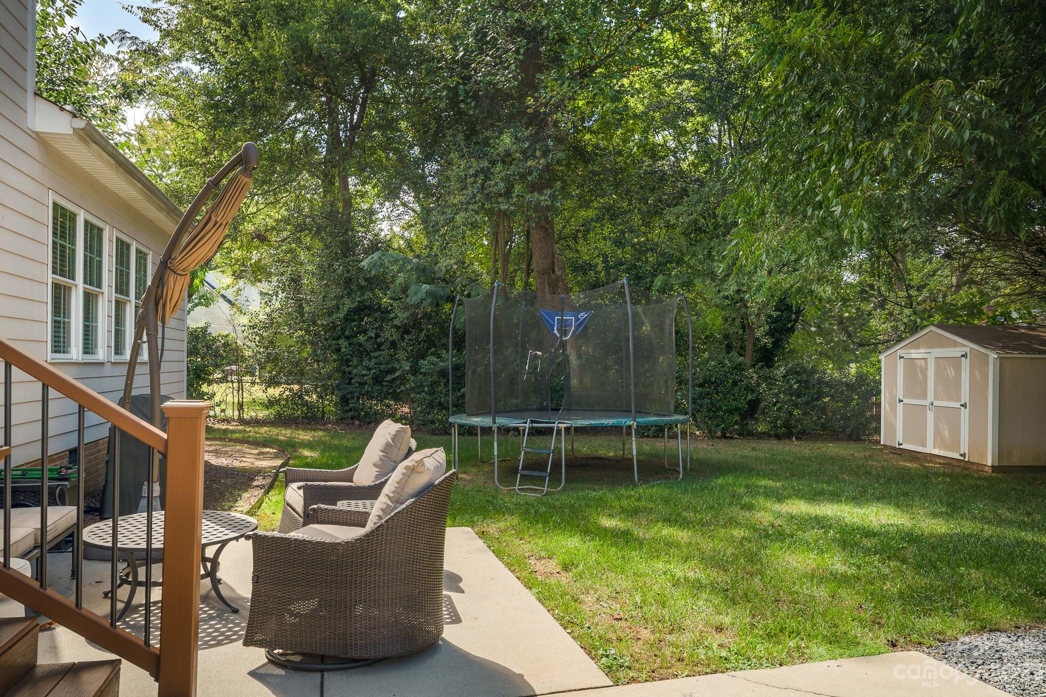 5816 Sharon Road Charlotte, NC 28210 - Photo 27 of 33 a view of a chair and table in the garden