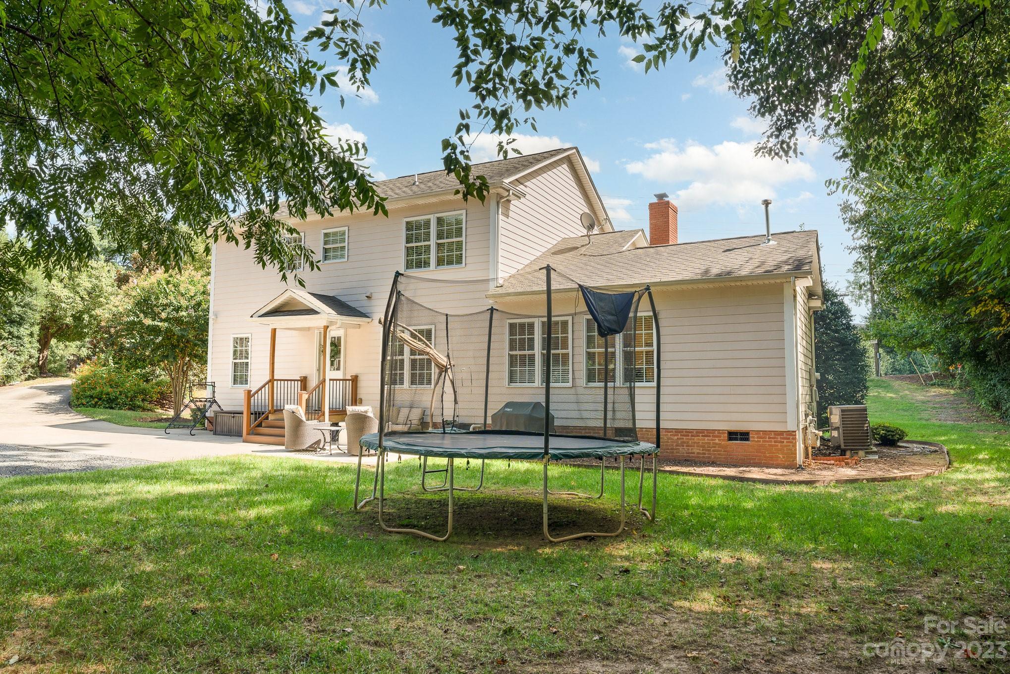 5816 Sharon Road Charlotte, NC 28210 - Photo 29 of 33 a view of a house with a yard