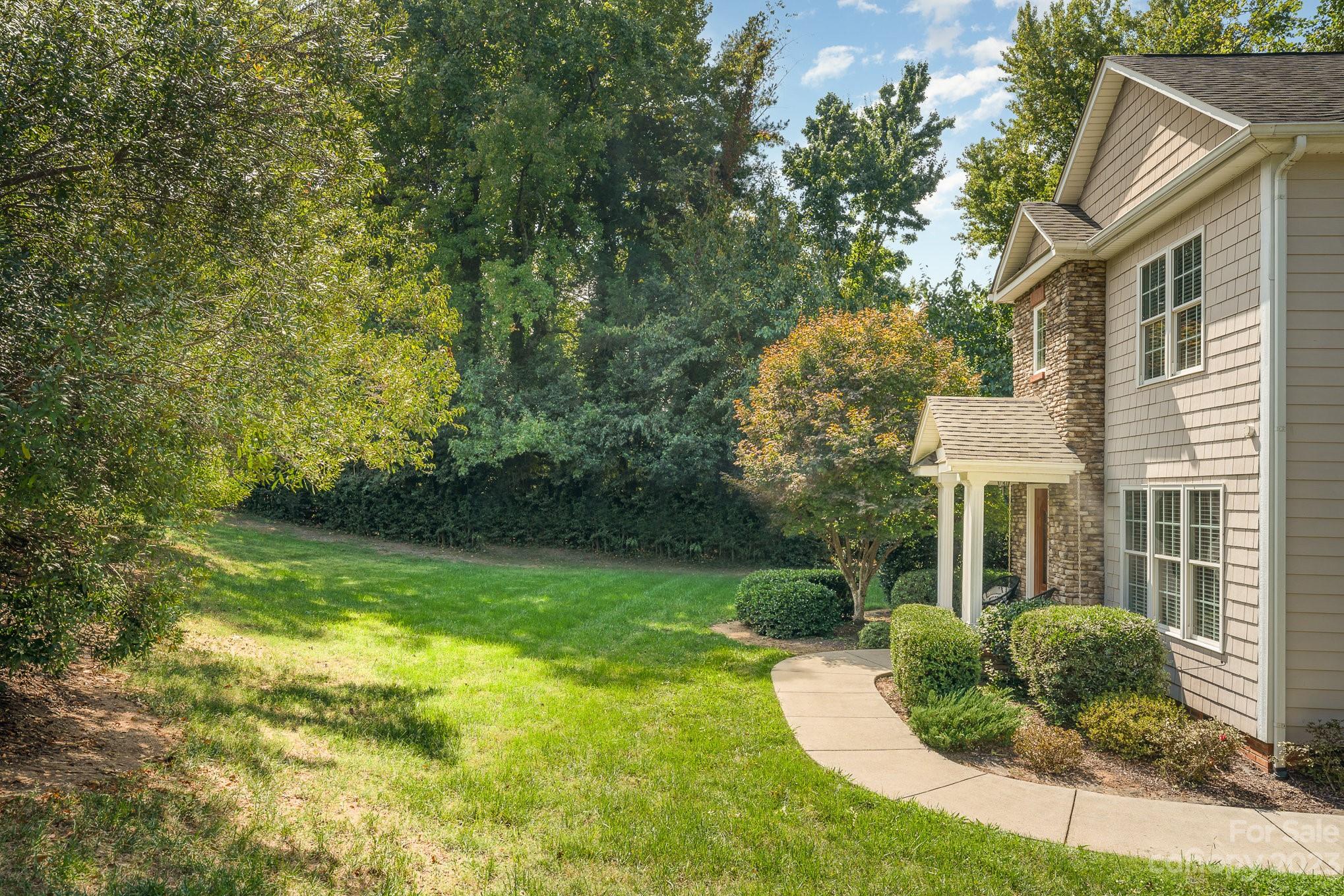 5816 Sharon Road Charlotte, NC 28210 - Photo 32 of 33 a view of a house with a yard
