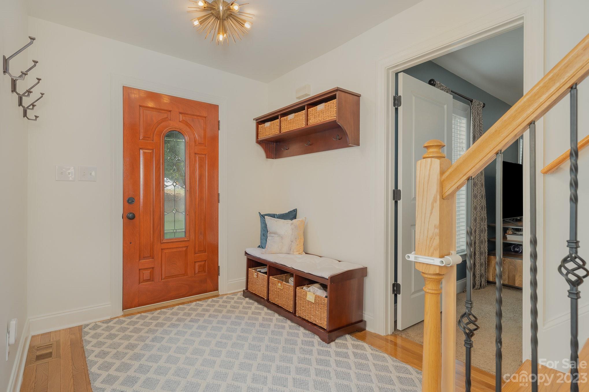 5816 Sharon Road Charlotte, NC 28210 - Photo 5 of 33 a living room with a bed furniture and a window
