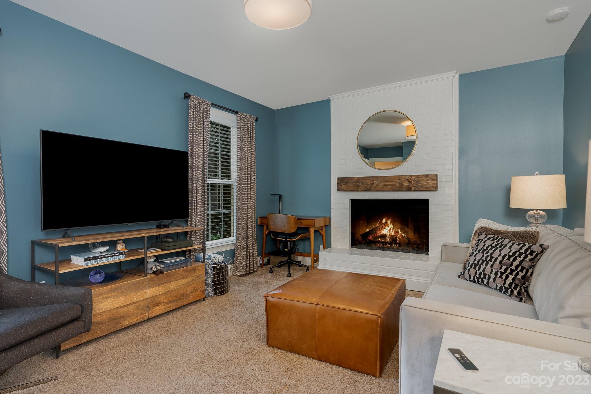 5816 Sharon Road Charlotte, NC 28210 - Photo 6 of 33 a living room with furniture and a flat screen tv
