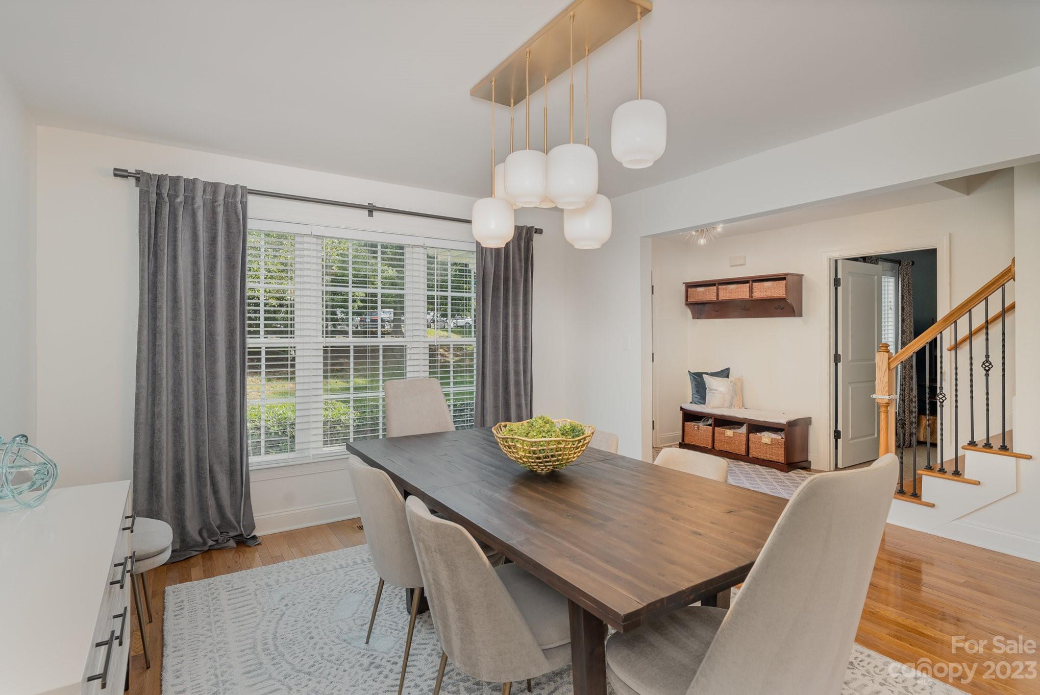 5816 Sharon Road Charlotte, NC 28210 - Photo 7 of 33 a view of a dining room with furniture window and wooden floor