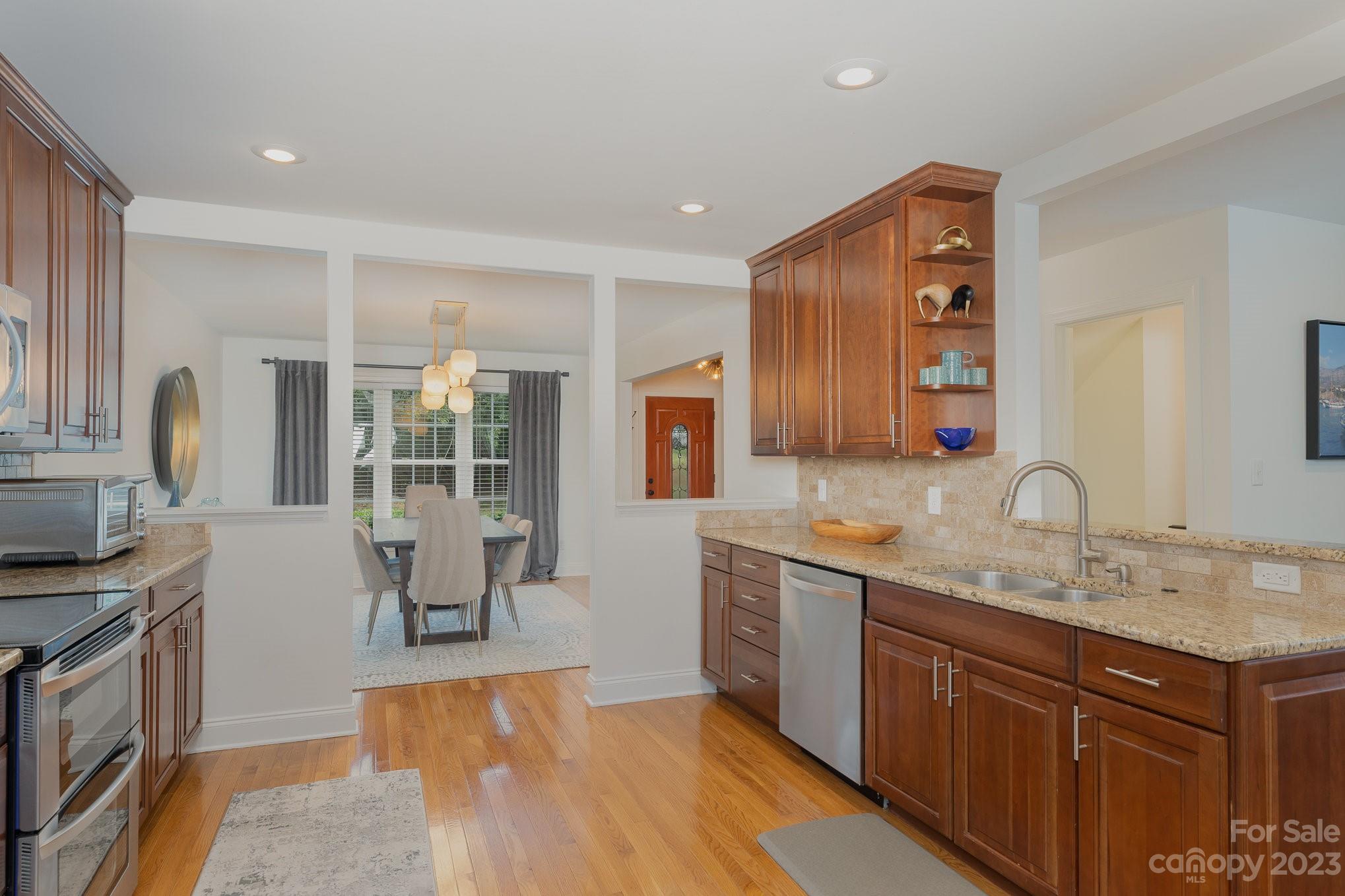 5816 Sharon Road Charlotte, NC 28210 - Photo 8 of 33 a spacious bathroom with a granite countertop sink and a mirror