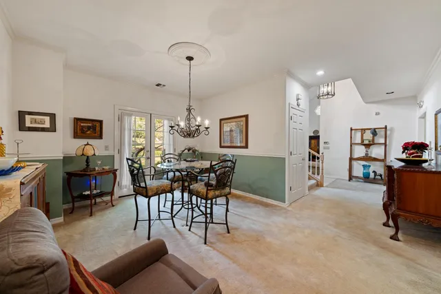 a bedroom with a bed and a lamp