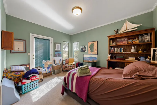 a spacious bedroom with a bed and a fireplace