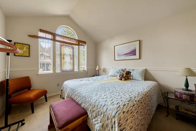 a backyard of a house with a yard and outdoor seating