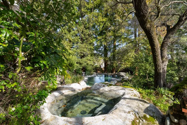 a front view of a house with a yard and pathway
