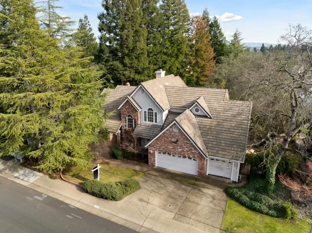 a view of staircase with a rug and a chandelier