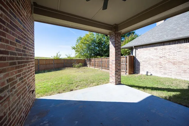 a view of backyard with green space