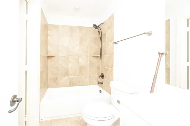 a bathroom with a shower curtain and a sink