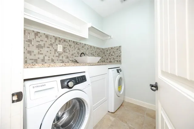 a utility room with dryer and washer