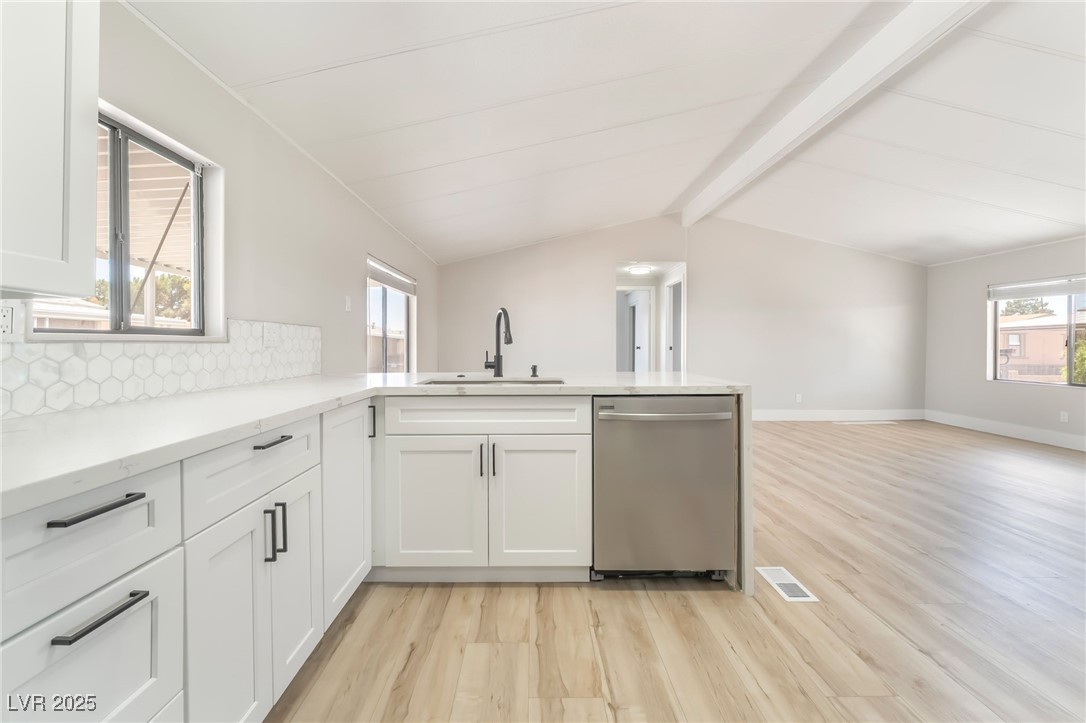 5552 Aldama Road Las Vegas, NV 89122 - Photo 14 of 35 Kitchen with dishwasher, light wood finished floor