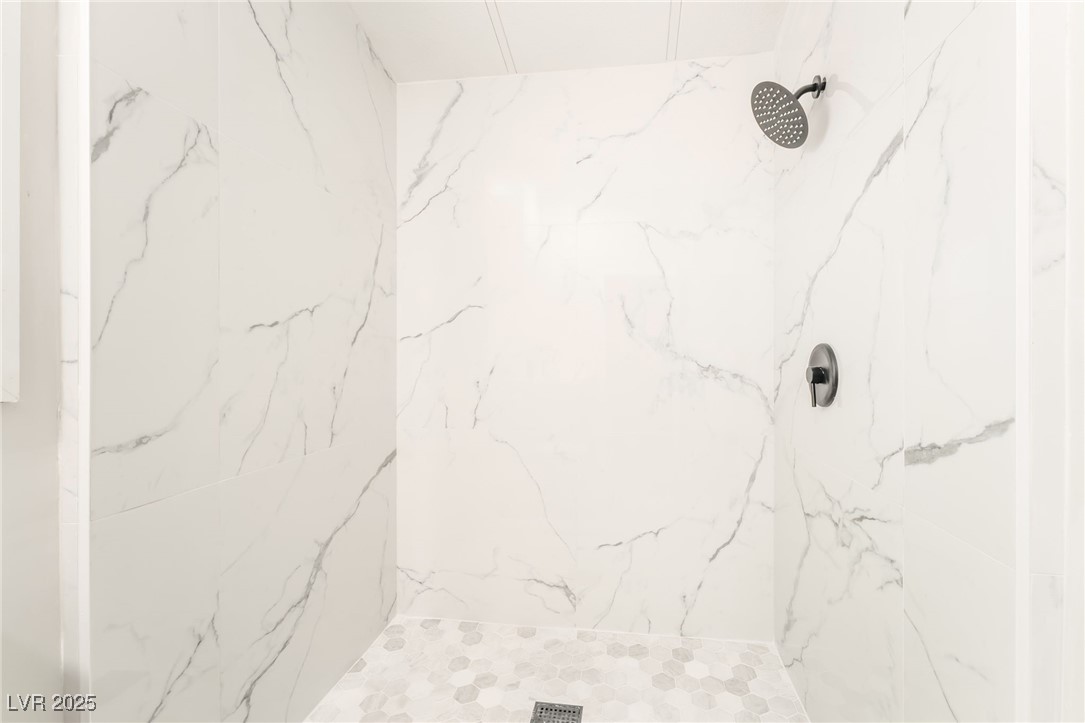 5552 Aldama Road Las Vegas, NV 89122 - Photo 19 of 35 Full bath featuring a marble finish shower