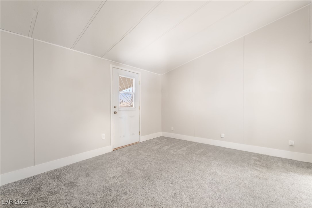 5552 Aldama Road Las Vegas, NV 89122 - Photo 21 of 35 Empty room with carpet flooring and baseboards