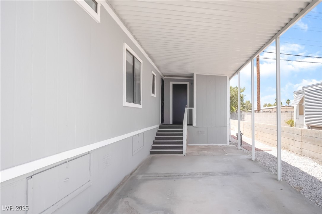 5552 Aldama Road Las Vegas, NV 89122 - Photo 4 of 35 View of patio / terrace with an attached carport