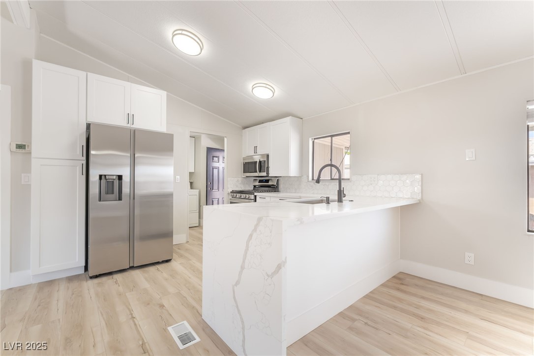 5552 Aldama Road Las Vegas, NV 89122 - Photo 9 of 35 Kitchen featuring appliances with stainless steel