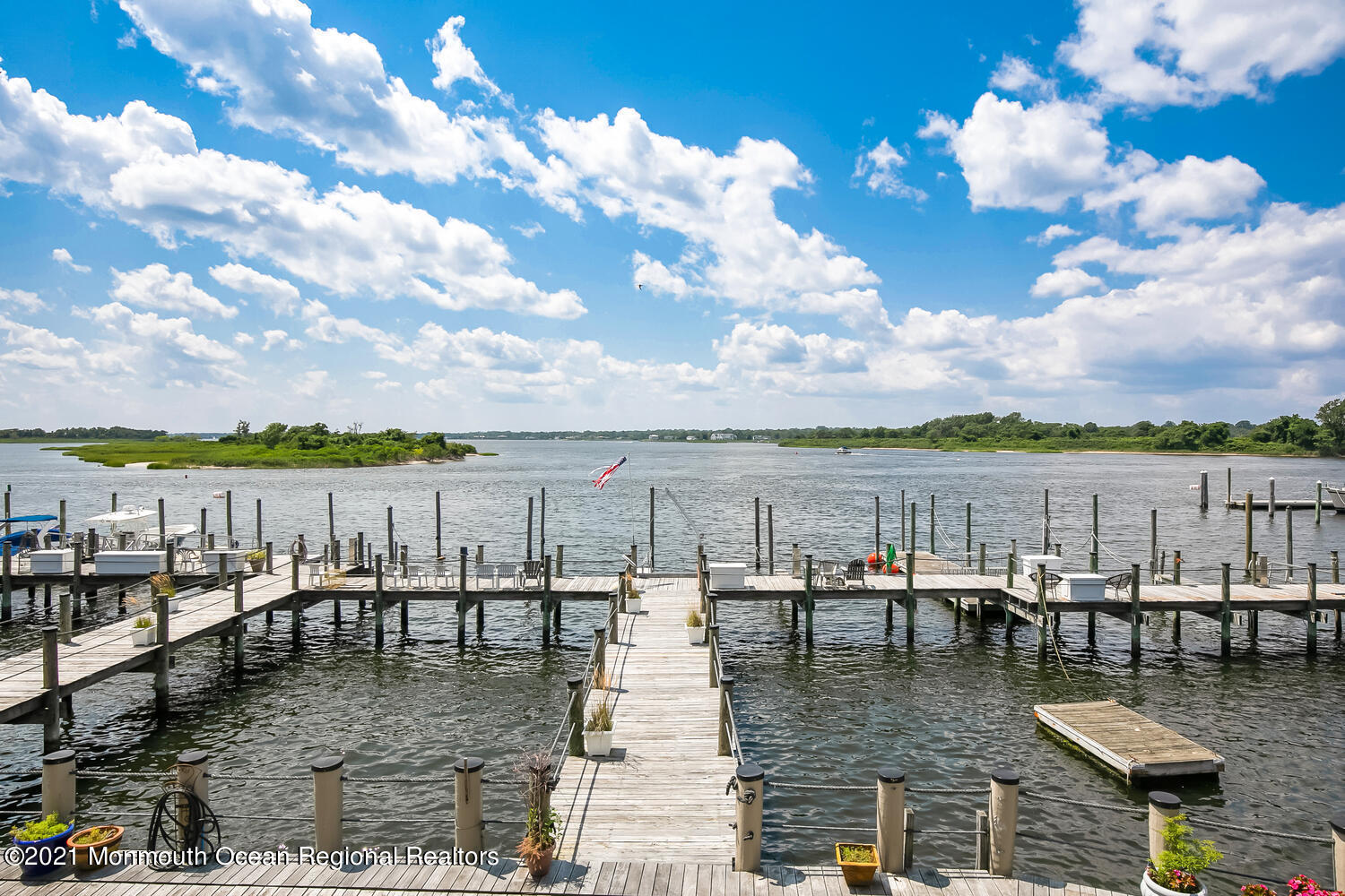 1332 Ocean Avenue, Unit 5R Sea Bright, NJ 07760 - Photo 14 of 40 a view of a lake with a city in the background