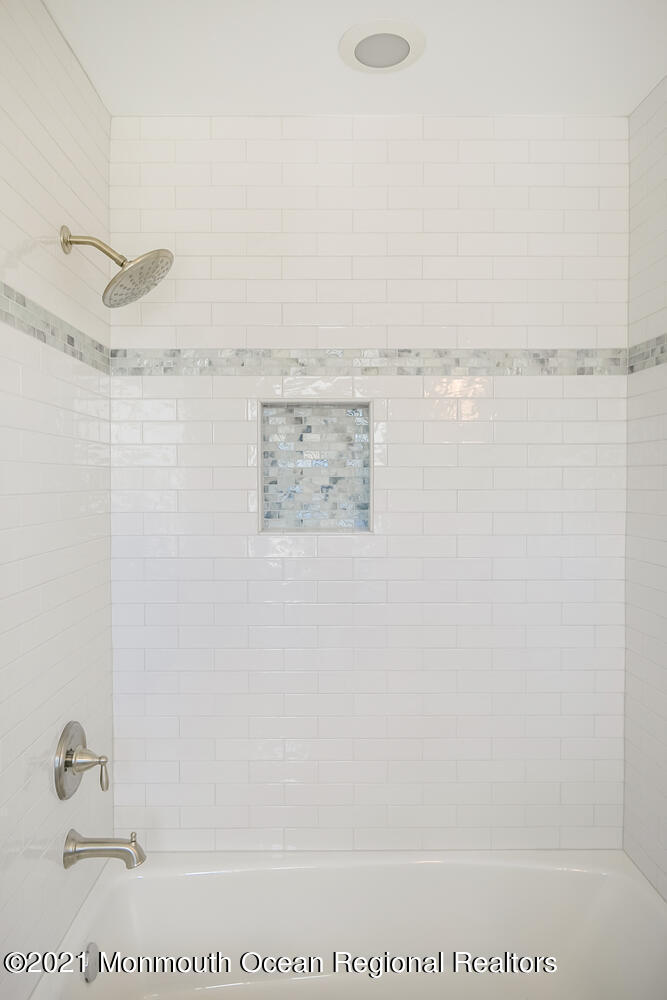 1332 Ocean Avenue, Unit 5R Sea Bright, NJ 07760 - Photo 17 of 40 a bathroom with a shower