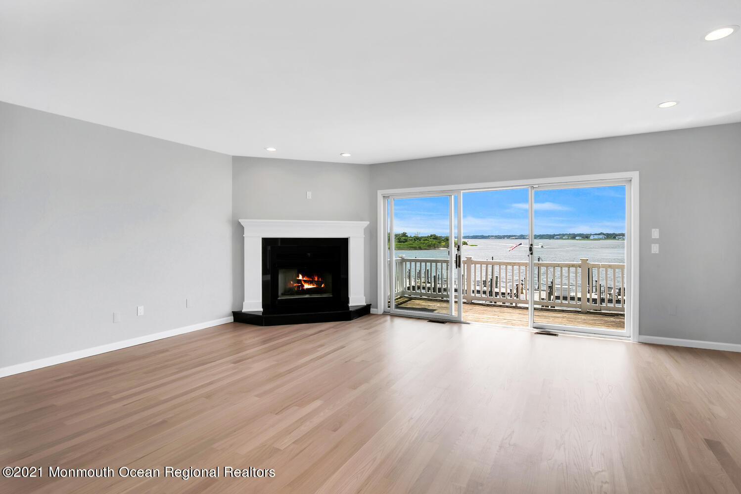 1332 Ocean Avenue, Unit 5R Sea Bright, NJ 07760 - Photo 2 of 40 a view of a room with wooden floor and a fireplace
