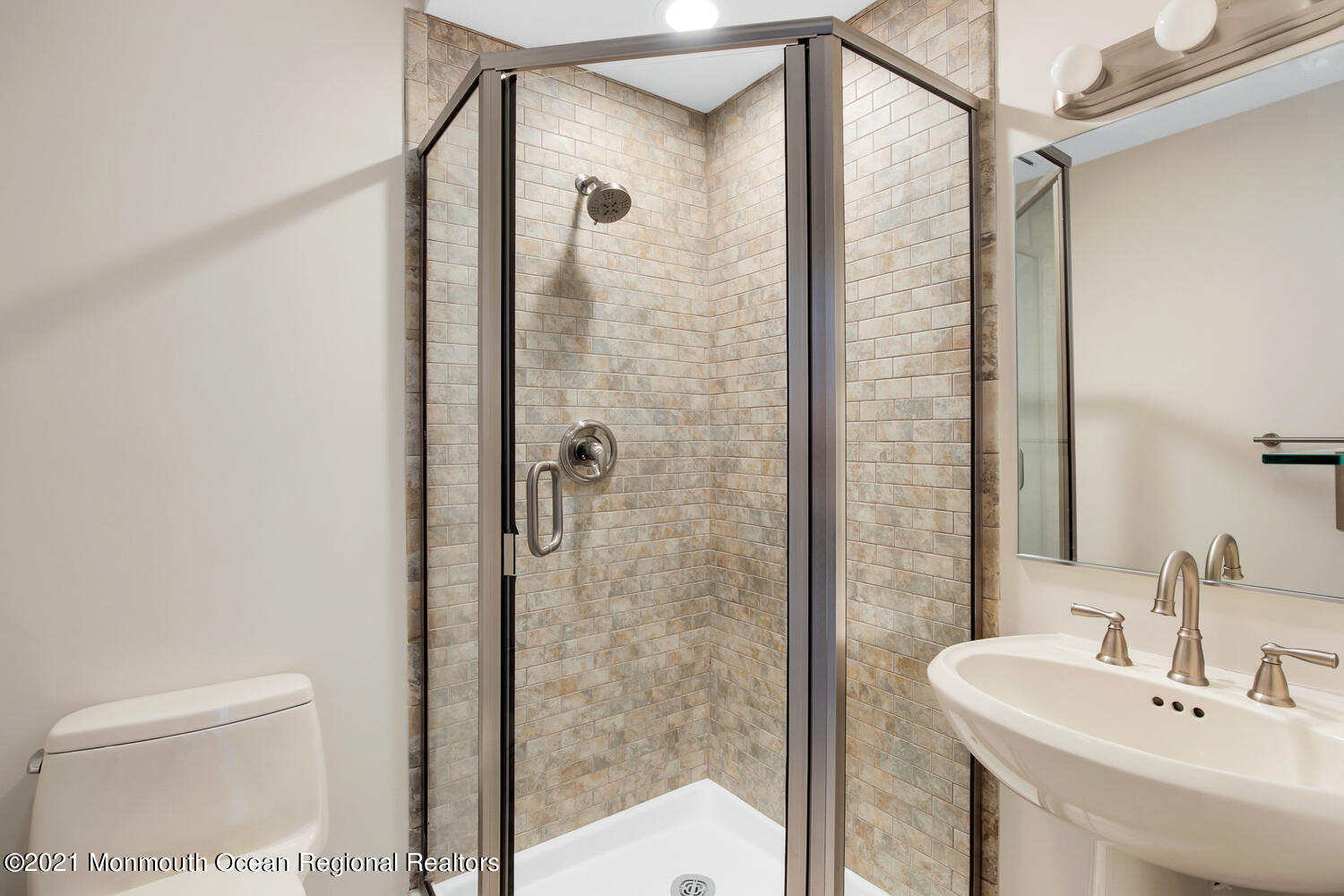 1332 Ocean Avenue, Unit 5R Sea Bright, NJ 07760 - Photo 25 of 40 a bathroom with a shower and a sink