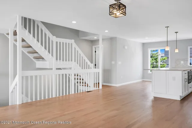 a view of an entryway with wooden floor