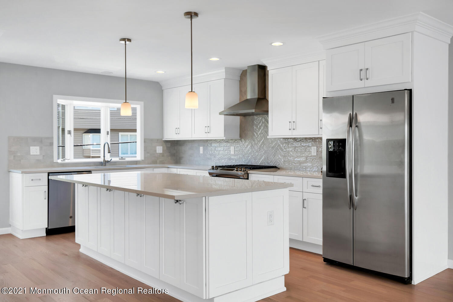 1332 Ocean Avenue, Unit 5R Sea Bright, NJ 07760 - Photo 6 of 40 a kitchen with stainless steel appliances granite countertop a sink a stove a refrigerator and island