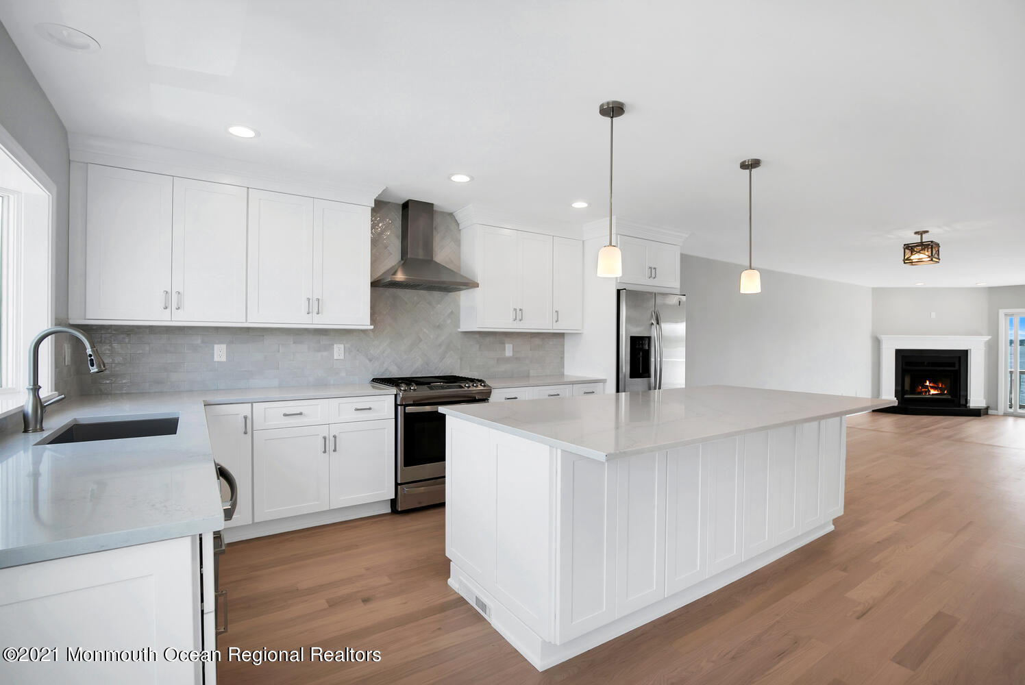 1332 Ocean Avenue, Unit 5R Sea Bright, NJ 07760 - Photo 8 of 40 a kitchen with stainless steel appliances granite countertop a sink a stove and a wooden floors