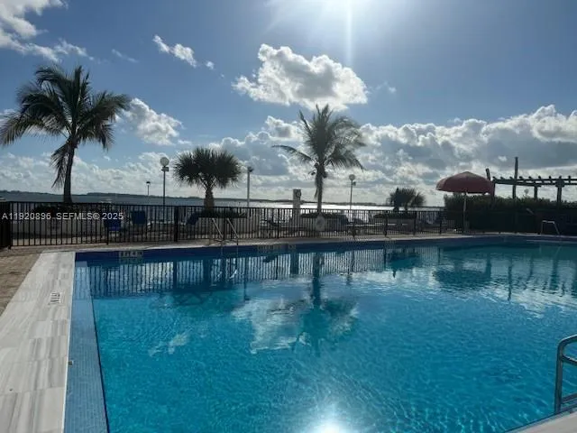 a view of a patio with table and chairs potted plants