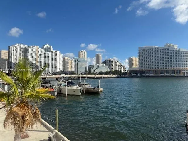 a group of people sitting in front of retail shop