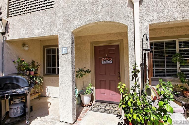 1007 Waltham Road, Unit F Simi Valley, CA 93065 - Photo 2 of 32 a front view of a house with a potted plant