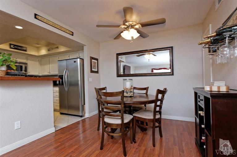 1007 Waltham Road, Unit F Simi Valley, CA 93065 - Photo 11 of 32 a view of a dining room with furniture and wooden floor