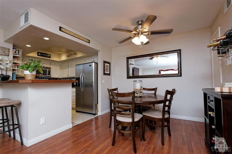1007 Waltham Road, Unit F Simi Valley, CA 93065 - Photo 12 of 32 a view of a dining room with furniture and wooden floor
