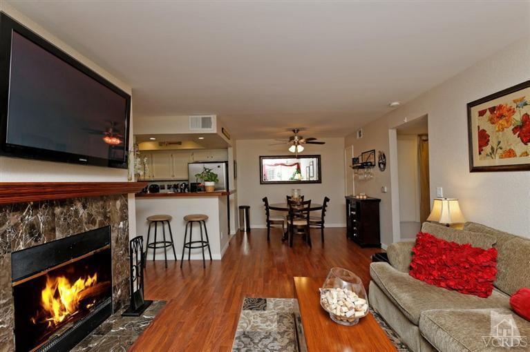1007 Waltham Road, Unit F Simi Valley, CA 93065 - Photo 14 of 32 a living room with furniture and a flat screen tv