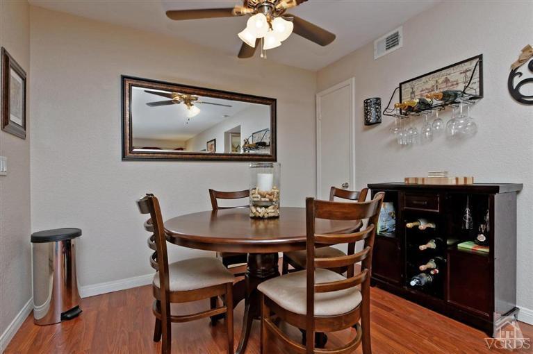 1007 Waltham Road, Unit F Simi Valley, CA 93065 - Photo 15 of 32 a view of a dining room with furniture and wooden floor