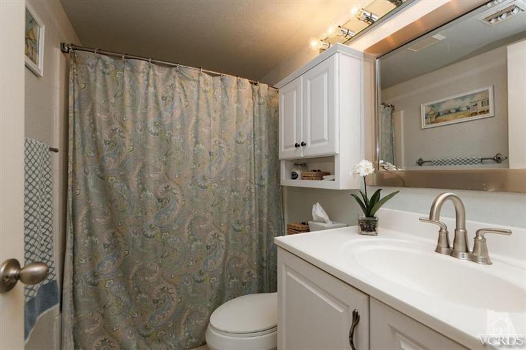1007 Waltham Road, Unit F Simi Valley, CA 93065 - Photo 18 of 32 a bathroom with a sink a toilet and shower