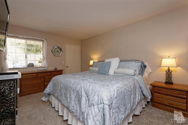 1007 Waltham Road, Unit F Simi Valley, CA 93065 - Photo 21 of 32 a bedroom with a bed and a window