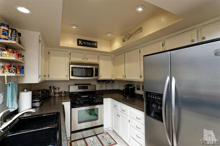 1007 Waltham Road, Unit F Simi Valley, CA 93065 - Photo 8 of 32 a kitchen with a refrigerator stove and sink