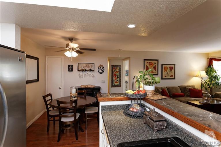 1007 Waltham Road, Unit F Simi Valley, CA 93065 - Photo 10 of 32 a living room with furniture and chandelier