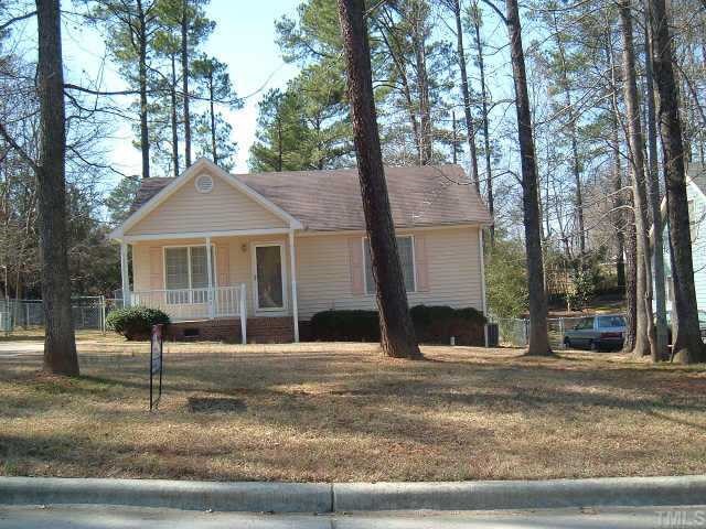 1005 Harper Road Raleigh, NC 27603 - Photo 1 of 1 a front view of a house with a yard and garage