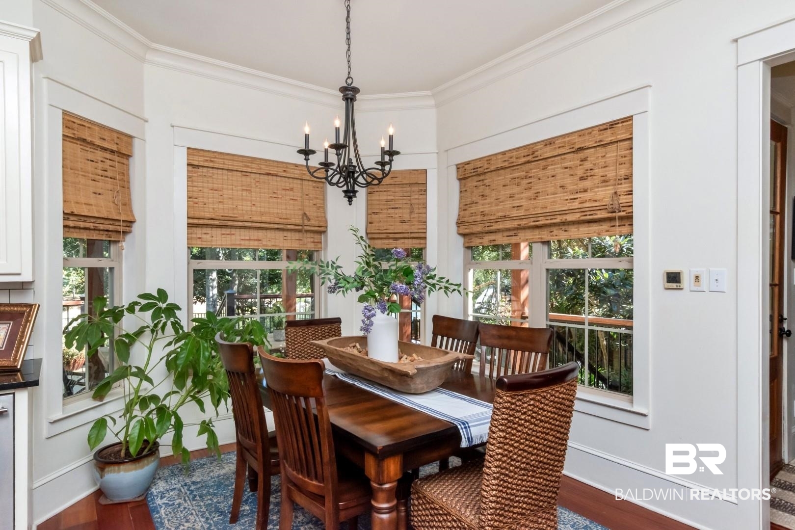 8868 Dawes Lake Road South Mobile, AL 36619 - Photo 10 of 35 Dining area featuring ornamental molding, dark wood-type flooring, and a chandelier