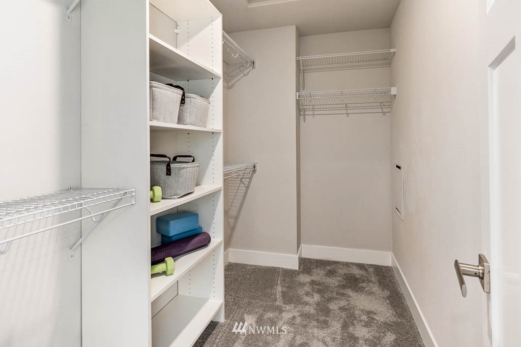 22816 22nd Avenue West, Unit EP 19 Bothell, WA 98021 - Photo 11 of 27 a living room with furniture and a gate