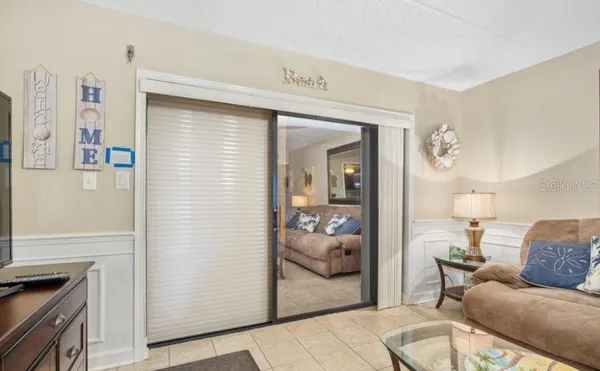 a living room with furniture and a gate