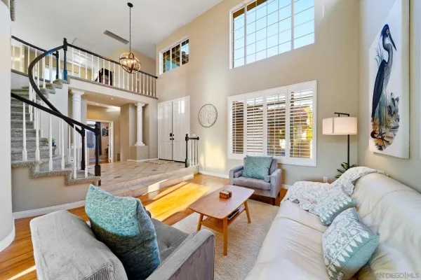a dining room with furniture wooden floor and a rug