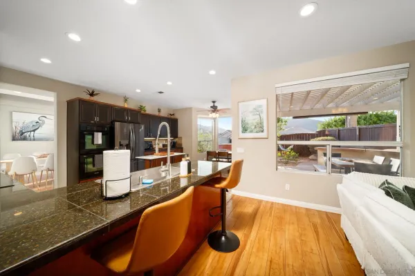 a view of a dining room with furniture window and outside view