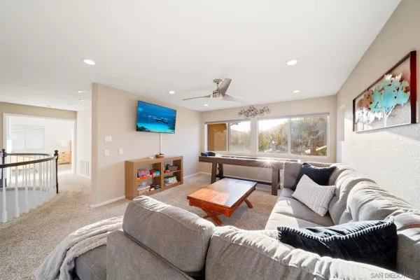 a view of a living room with a table and chair