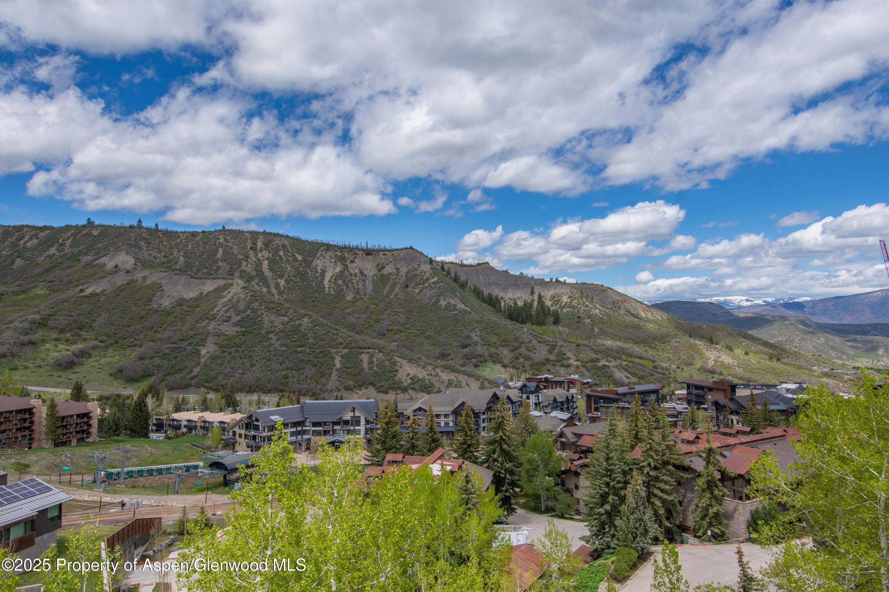 425 Wood Road, Unit 48 Snowmass Village, CO 81615 - Photo 11 of 41 an aerial view of residential building with trees