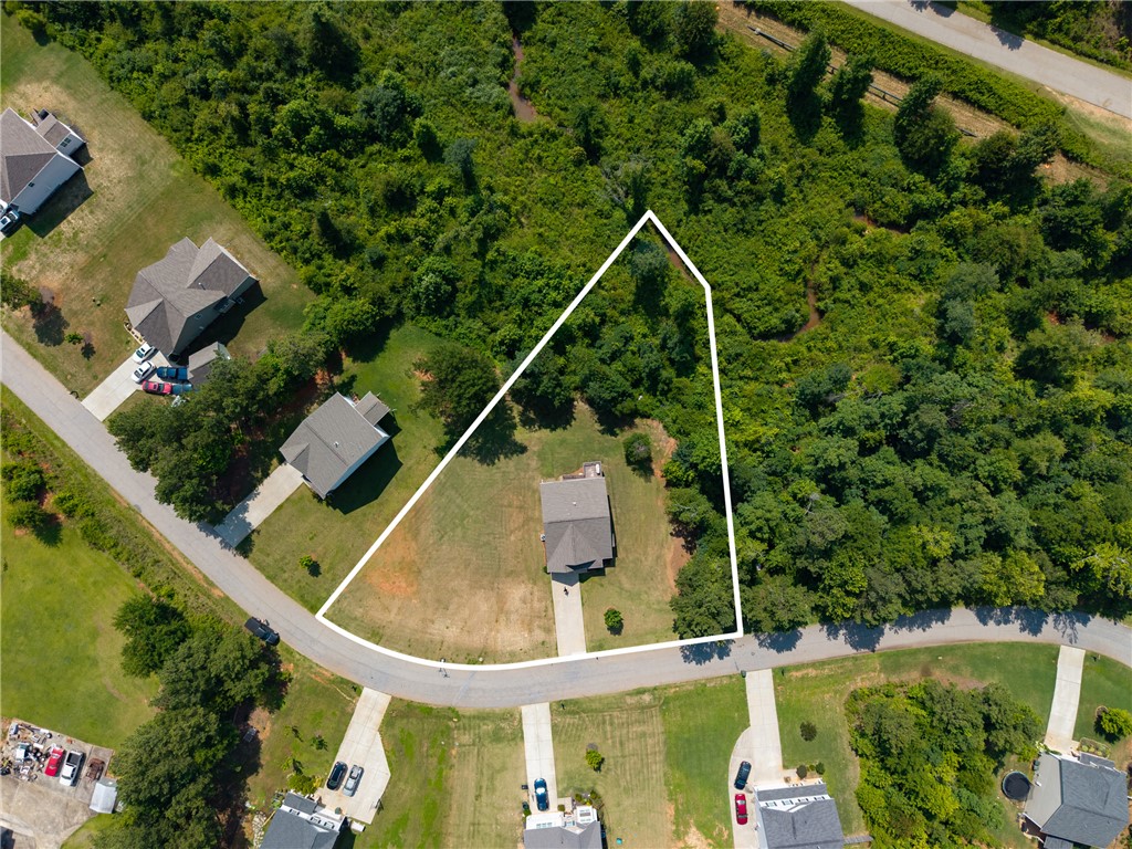 768 Rocky Ridge Circle Seneca, SC 29678 - Photo 2 of 30 An aerial perspective reveals a substantial, undeveloped lot amidst a residential area, ripe for building.